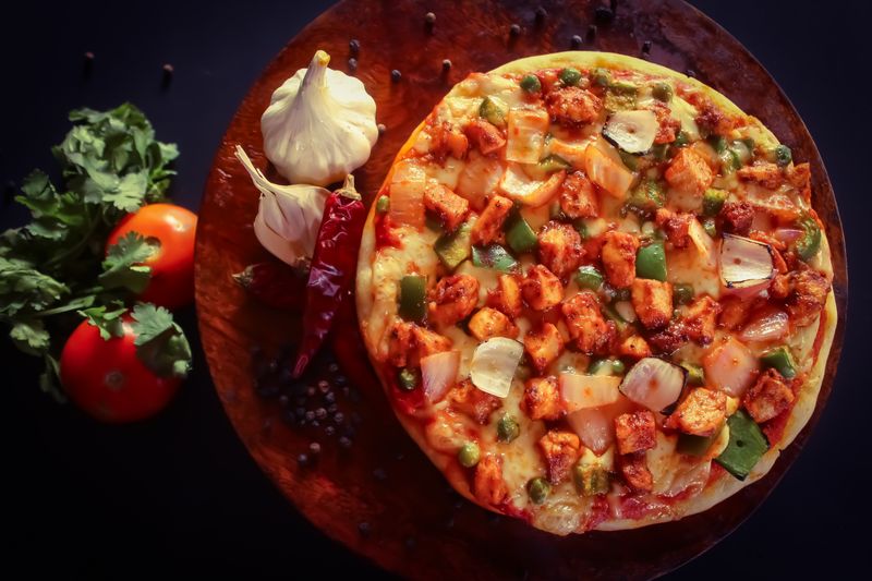Margherita thin crust pizza with fresh basil